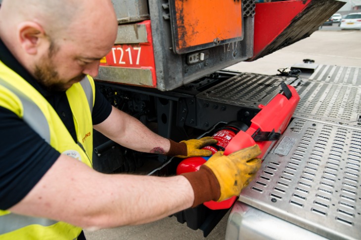 Suttons logistics driver running safety checks on gas transportation vehicle.