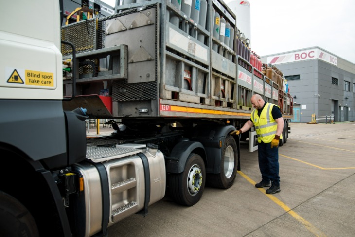 Suttons driver checking gas transportation vehicle.