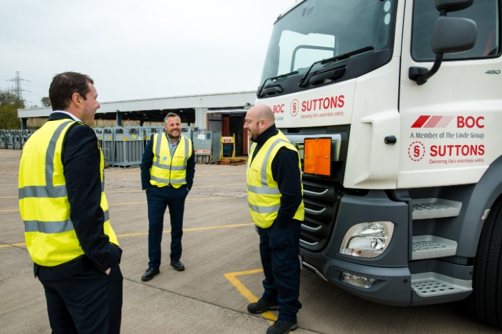 Suttons Logistics team stood beside specialised gas transportation lorry.